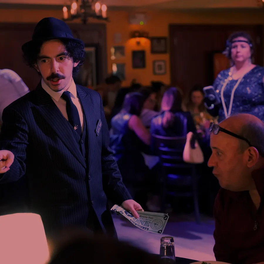 A Murder Mystery Company actor working the room at a Charlotte show
